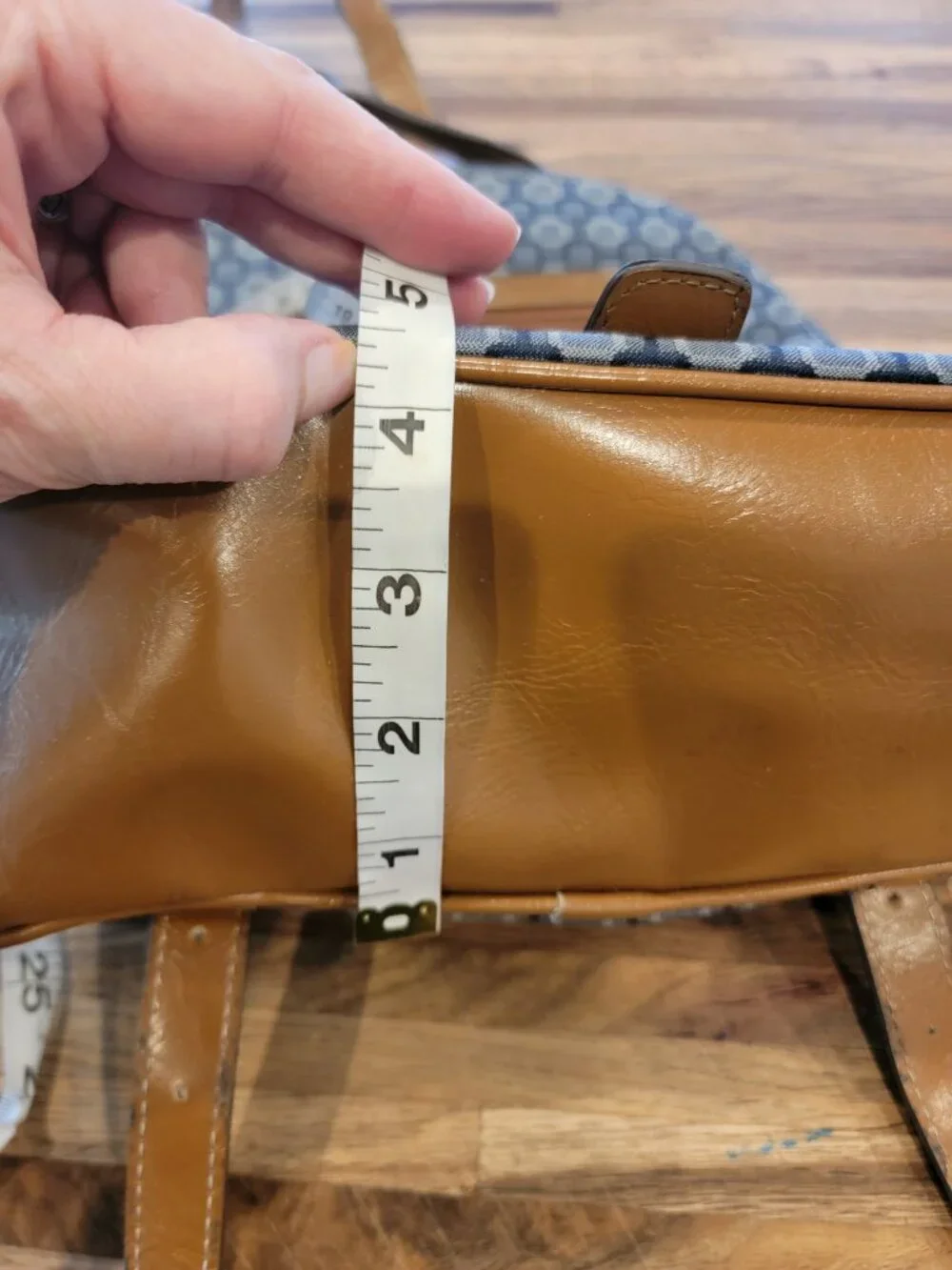 Nine West backpack purse featuring a geometric pattern and brown faux leather tr